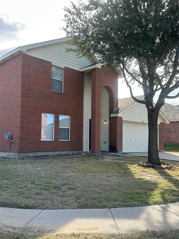 a house that has a tree in front of it