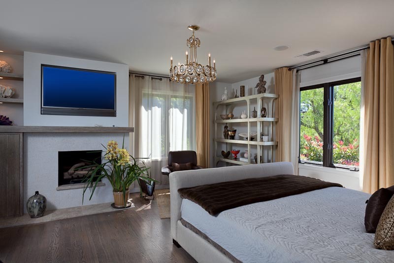1021 Las Alturas Road Santa Barbara, CA 93103 - Photo 11 of 20 a bedroom with a large bed and a bookshelf