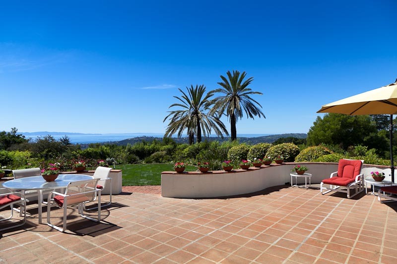 1021 Las Alturas Road Santa Barbara, CA 93103 - Photo 18 of 20 a view of a patio with a table and chairs and potted plants