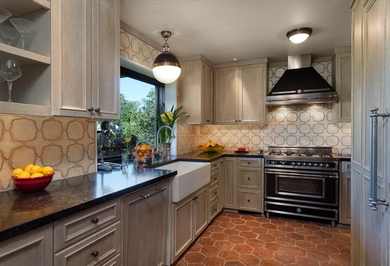 1021 Las Alturas Road Santa Barbara, CA 93103 - Photo 6 of 20 a kitchen with stainless steel appliances a sink a stove and cabinets