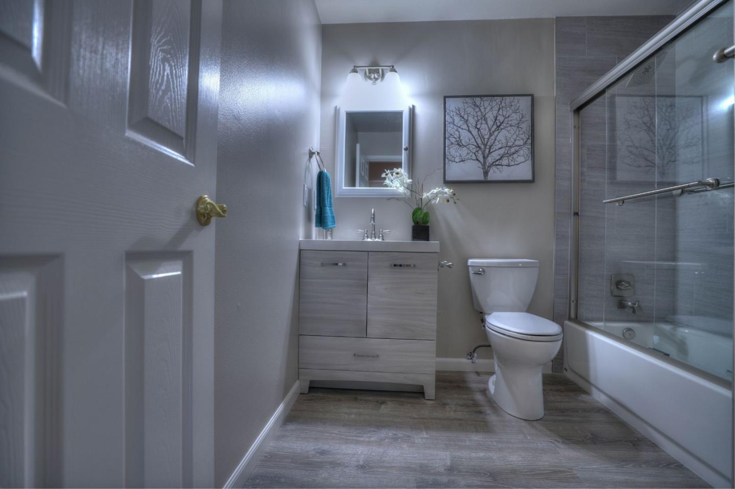 3802 West Rincon Avenue Campbell, CA 95008 - Photo 11 of 21 a bathroom with a toilet a sink and bathtub