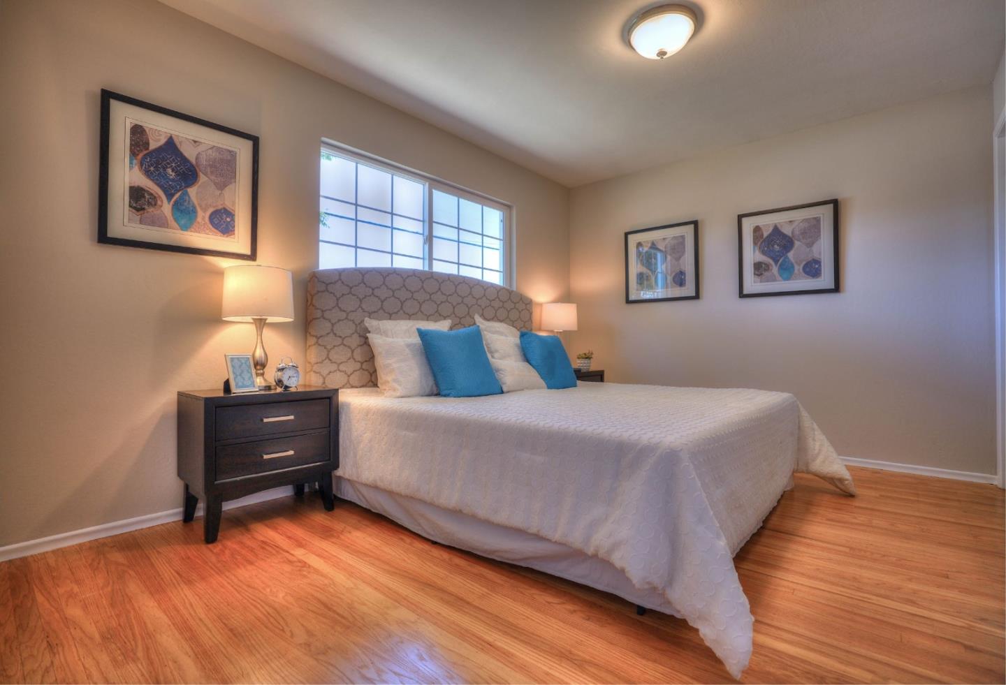 3802 West Rincon Avenue Campbell, CA 95008 - Photo 12 of 21 a bedroom with a bed and a window