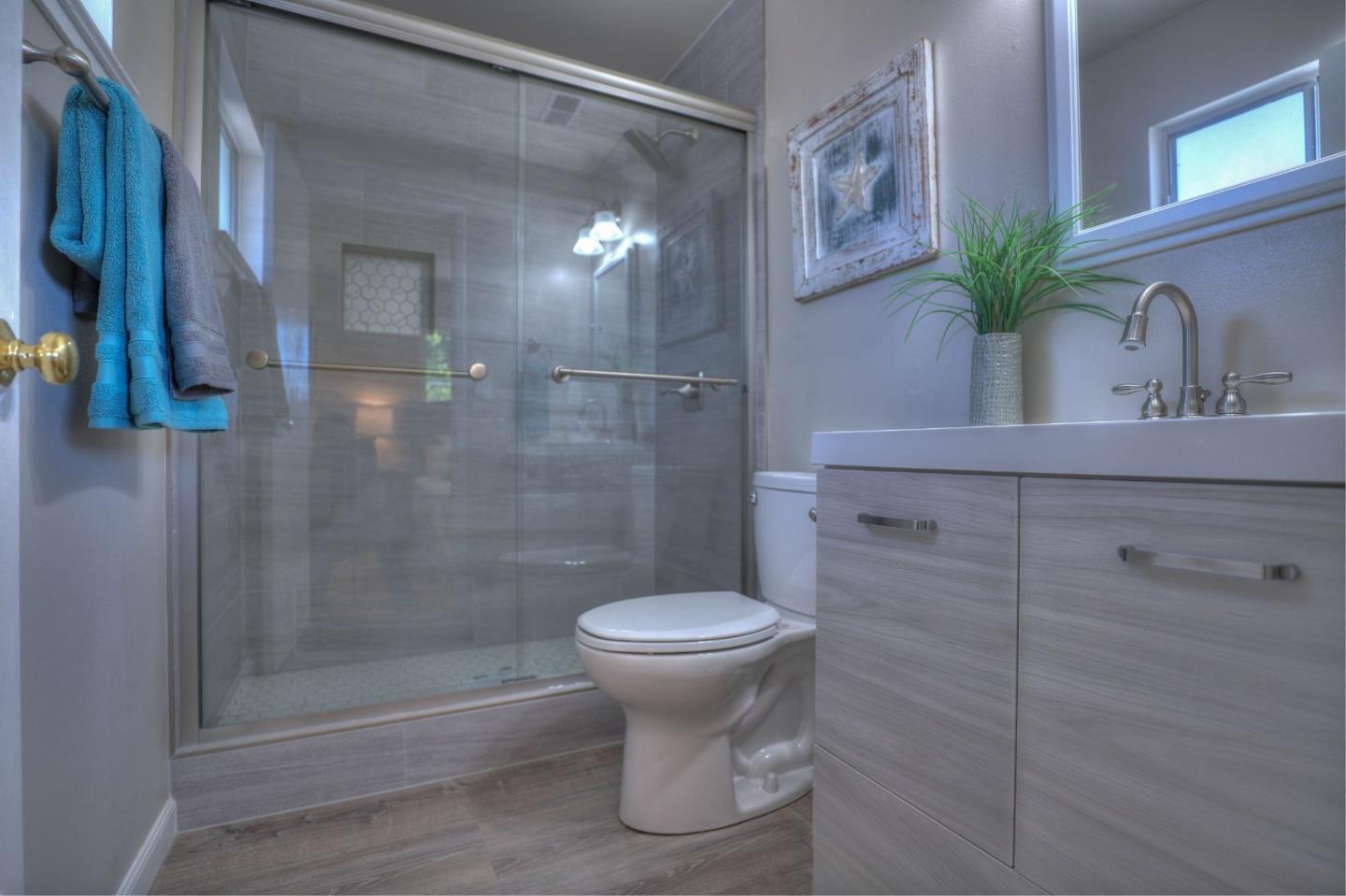 3802 West Rincon Avenue Campbell, CA 95008 - Photo 13 of 21 a bathroom with a toilet sink and shower