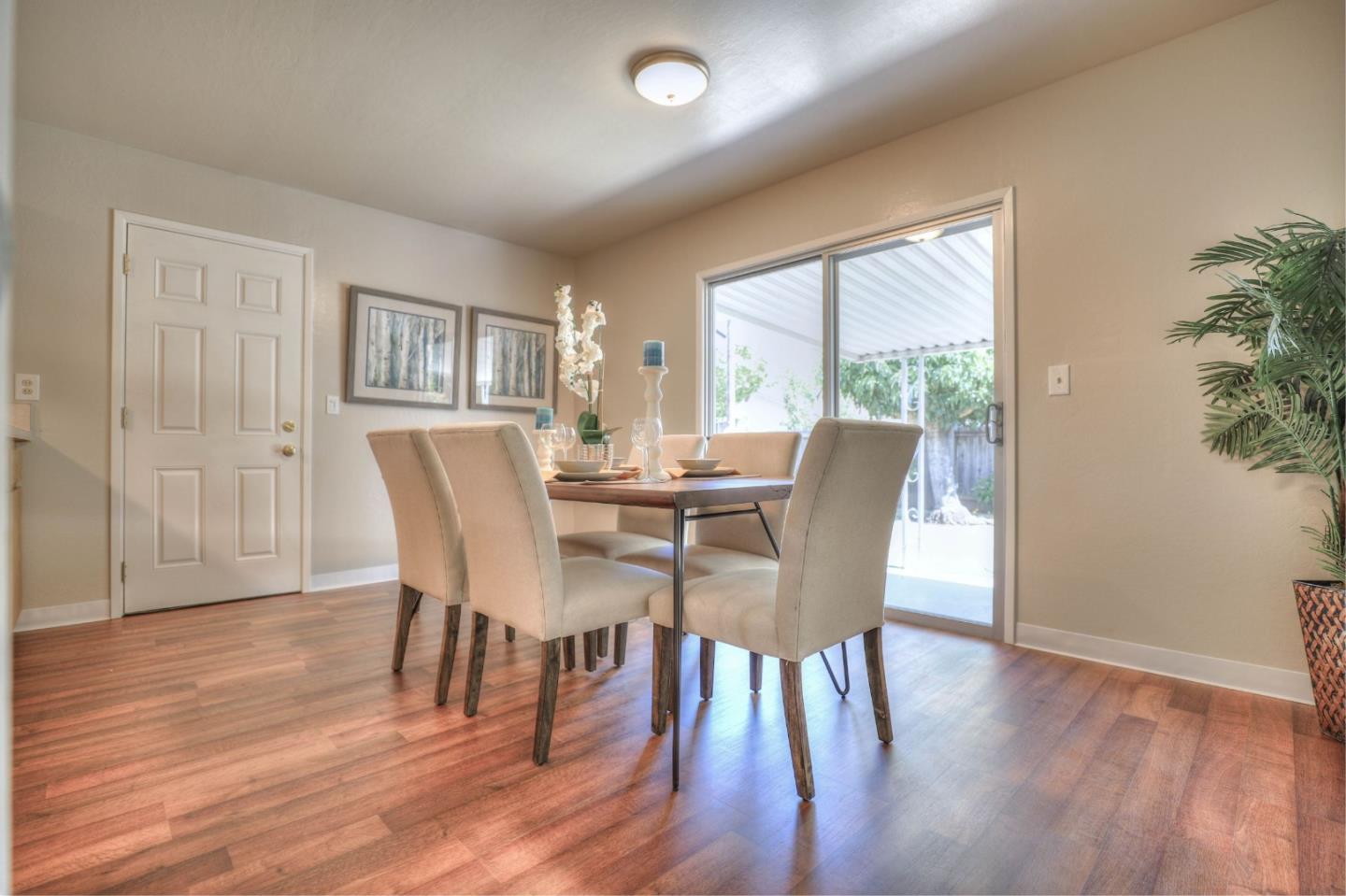 3802 West Rincon Avenue Campbell, CA 95008 - Photo 8 of 21 a view of a dining room with furniture and wooden floor