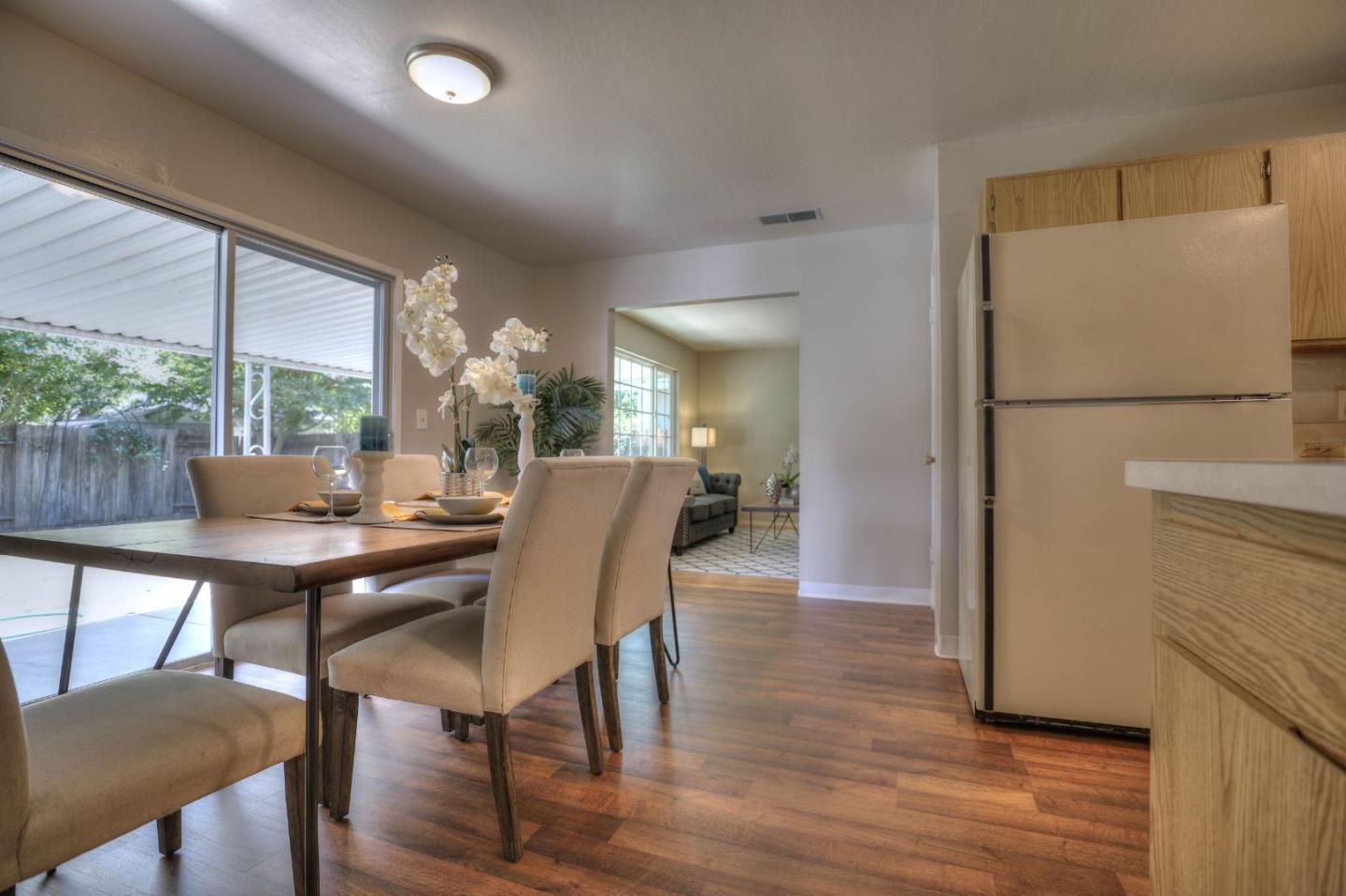 3802 West Rincon Avenue Campbell, CA 95008 - Photo 9 of 21 a view of a dining room with furniture window and wooden floor
