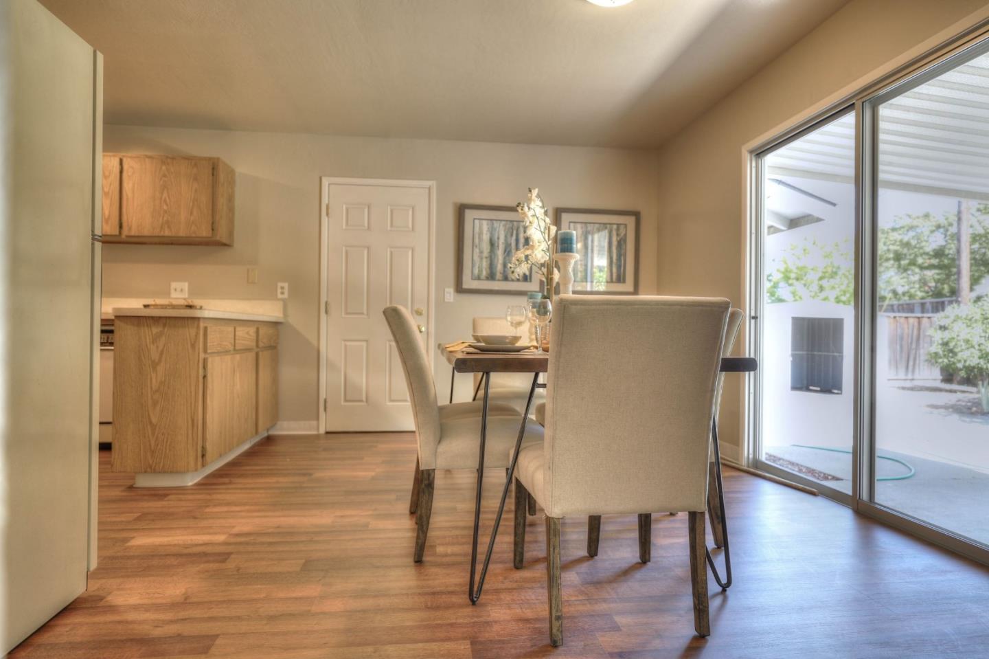 3802 West Rincon Avenue Campbell, CA 95008 - Photo 10 of 21 a view of a dining room with furniture and wooden floor