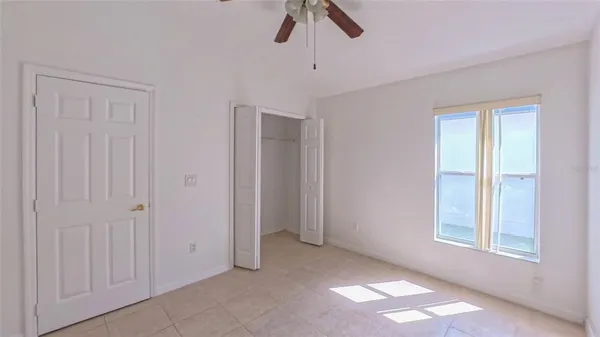 a view of livingroom with window and ceiling fan