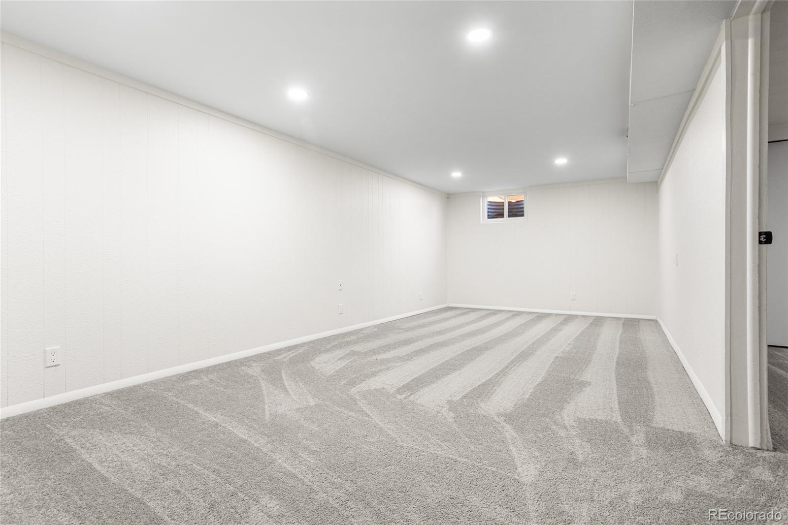 8140 Raleigh Street Westminster, CO 80031 - Photo 27 of 39 an empty room with a empty space and windows