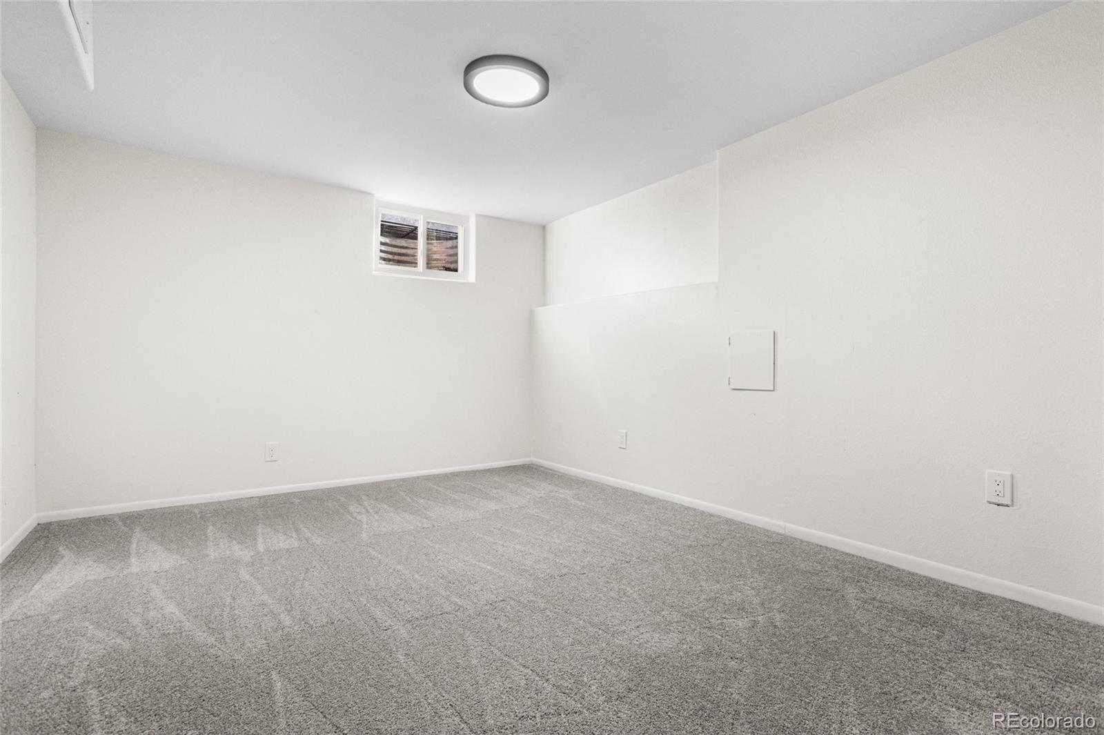 8140 Raleigh Street Westminster, CO 80031 - Photo 32 of 39 an empty room with a empty space and window