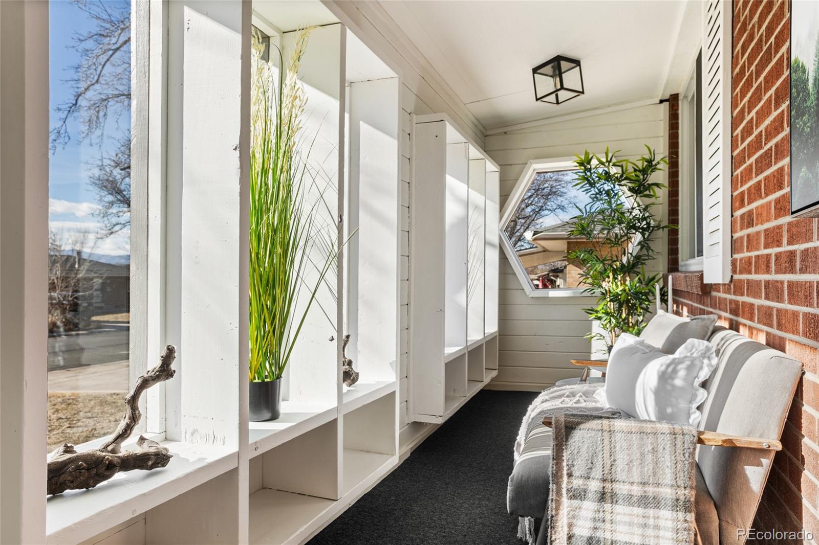 8140 Raleigh Street Westminster, CO 80031 - Photo 5 of 39 a living room with furniture and a large window