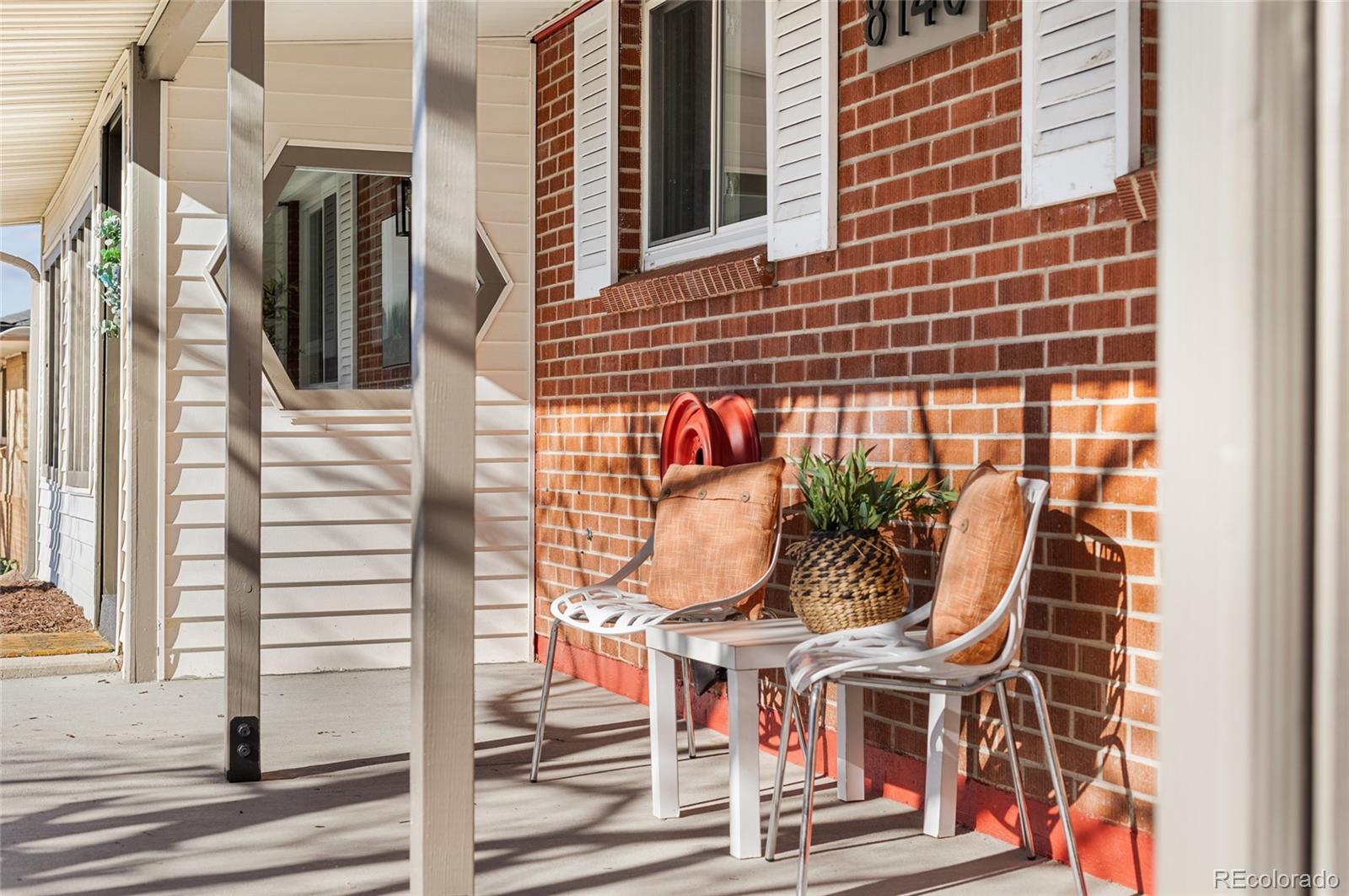 8140 Raleigh Street Westminster, CO 80031 - Photo 7 of 39 a view of entryway with wooden door