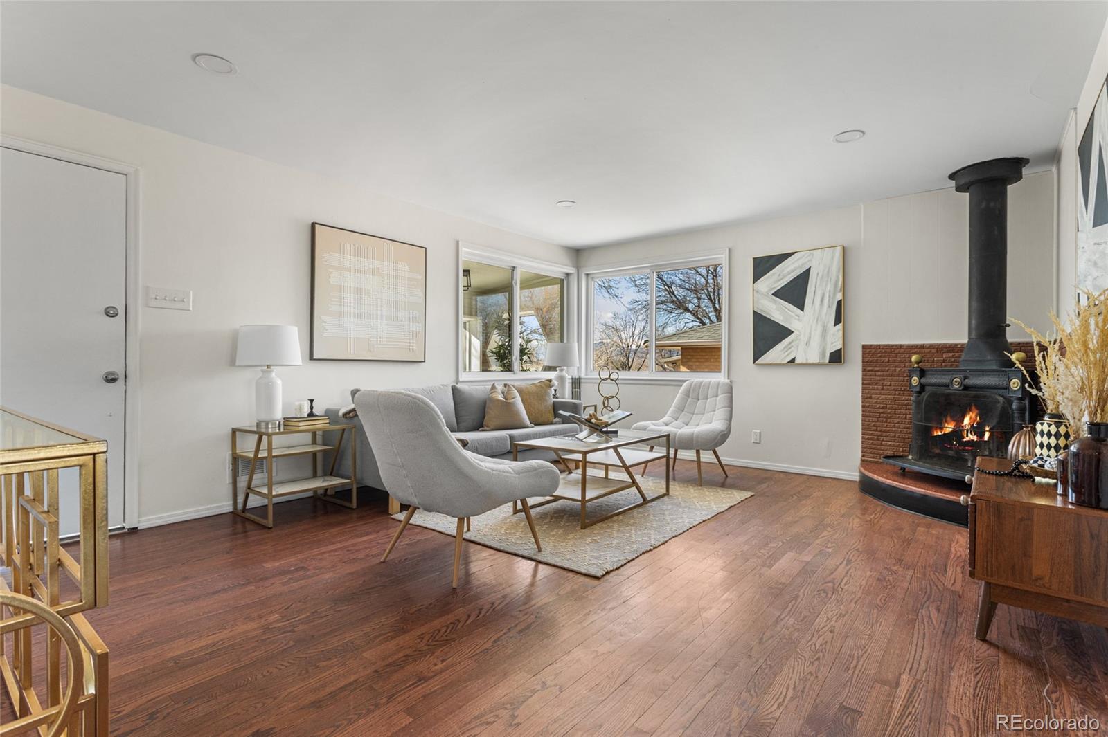 8140 Raleigh Street Westminster, CO 80031 - Photo 10 of 39 a living room with furniture and a wooden floor