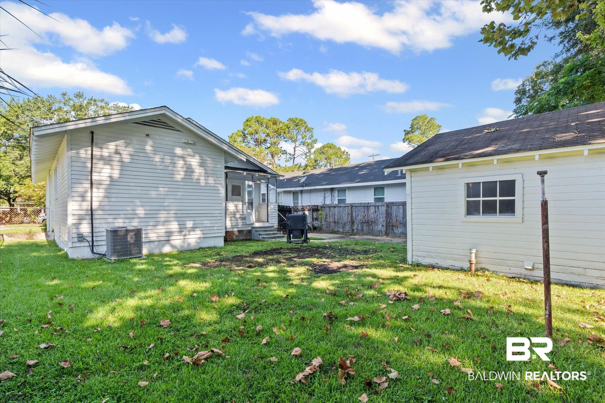 11 South Lafayette Street Mobile, AL 36604 - Photo 17 of 20 Rear view of house featuring a sunroom