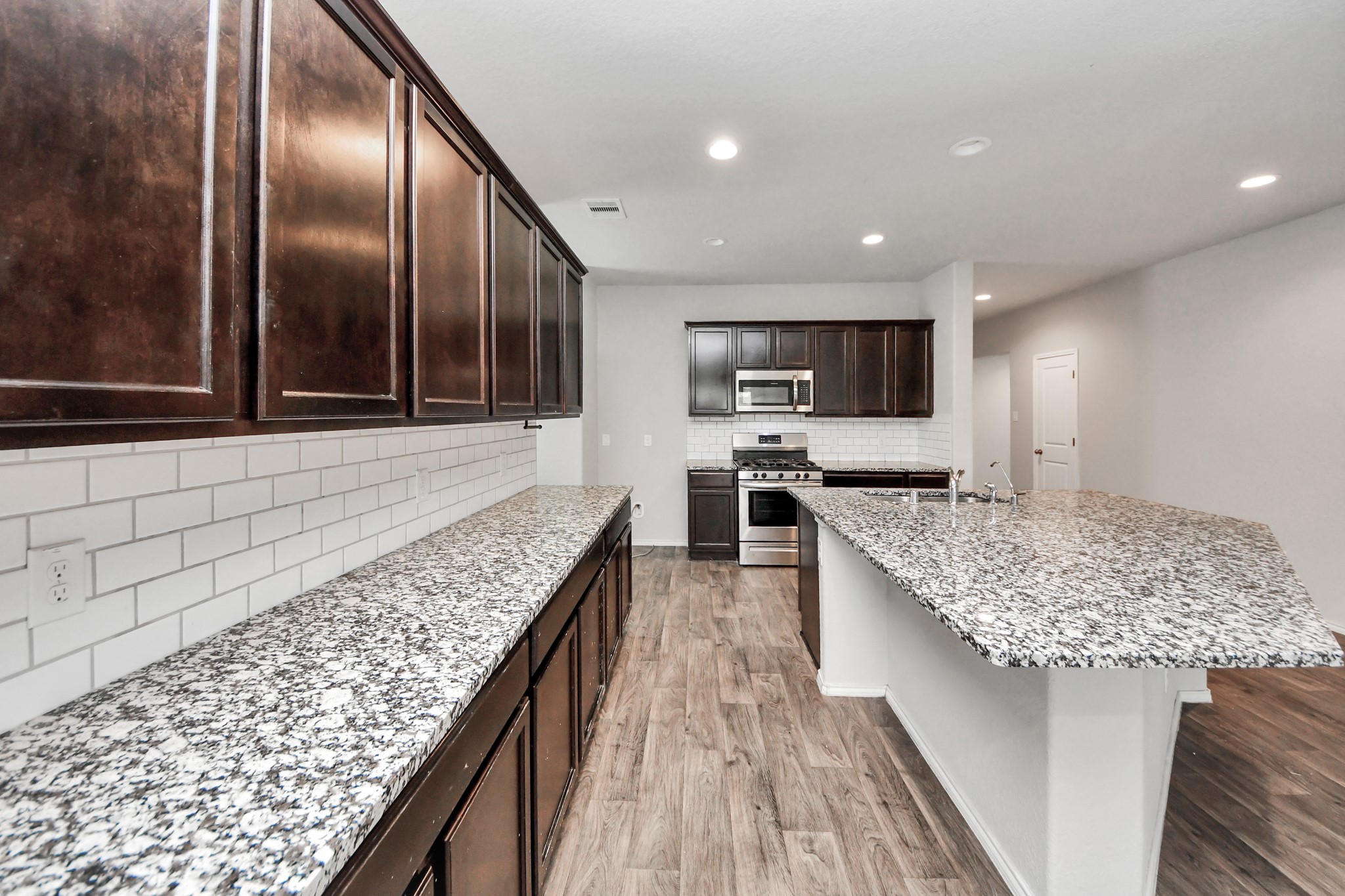 8302 Rose Petals Lane Rosharon, TX 77583 - Photo 35 of 42 Open-concept kitchen with granite countertops