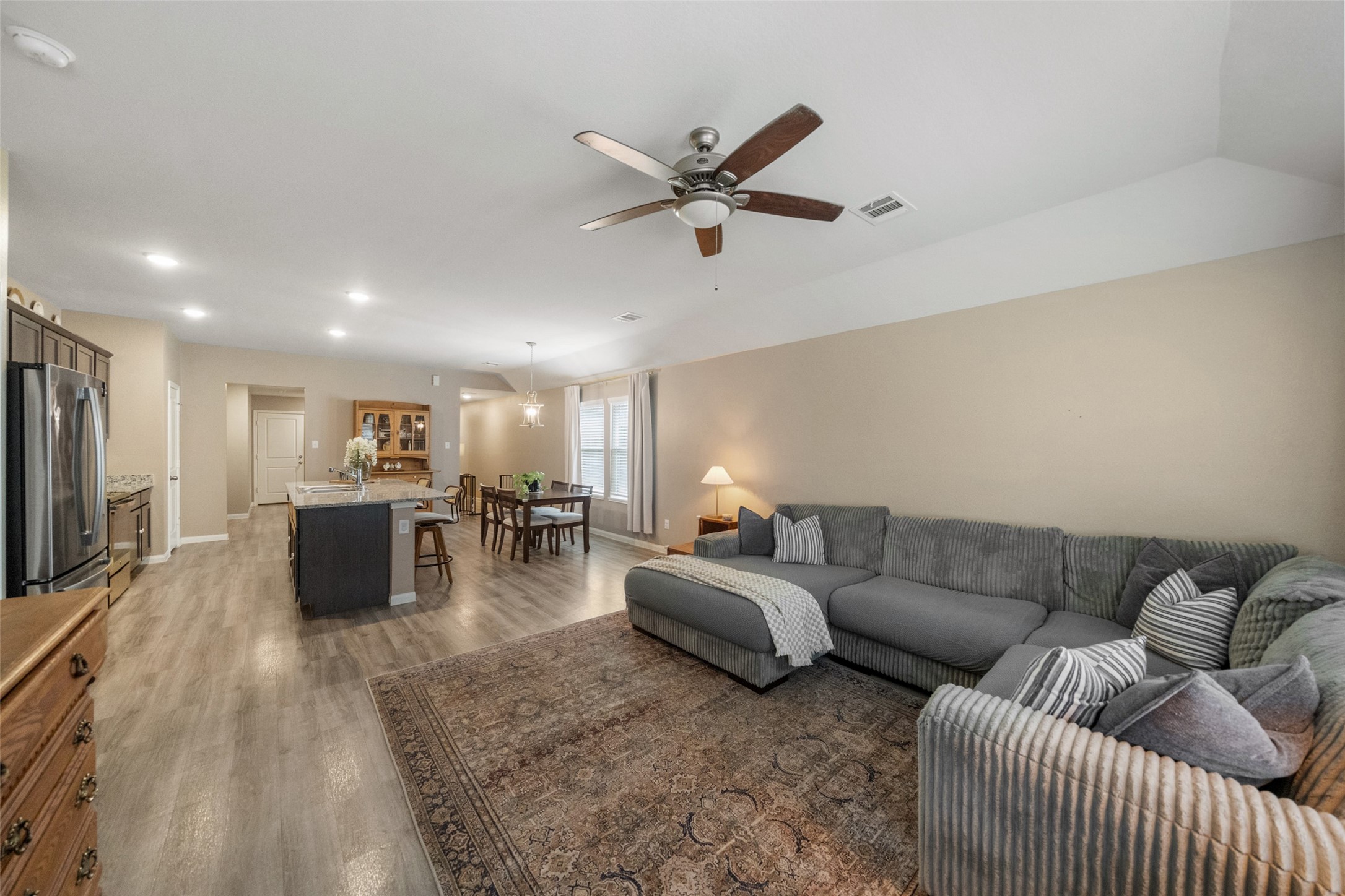 26431 Pin Oak Drive Hempstead, TX 77445 - Photo 13 of 32 Spacious living room with soaring ceiling, ceiling fan, and great open feel. Plenty of room for seating arrangements and media setup while maintaining a light, airy atmosphere.