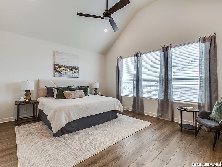 390 Rhapsody View Spring Branch, TX 78070 - Photo 19 of 28 a bedroom with a large bed and a large window