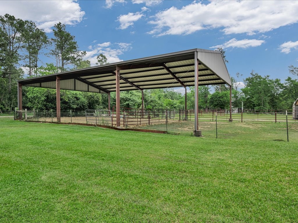 104 Wheeler Road Lufkin, TX 75901 - Photo 35 of 45 a backyard of a house with lots of green space and garden