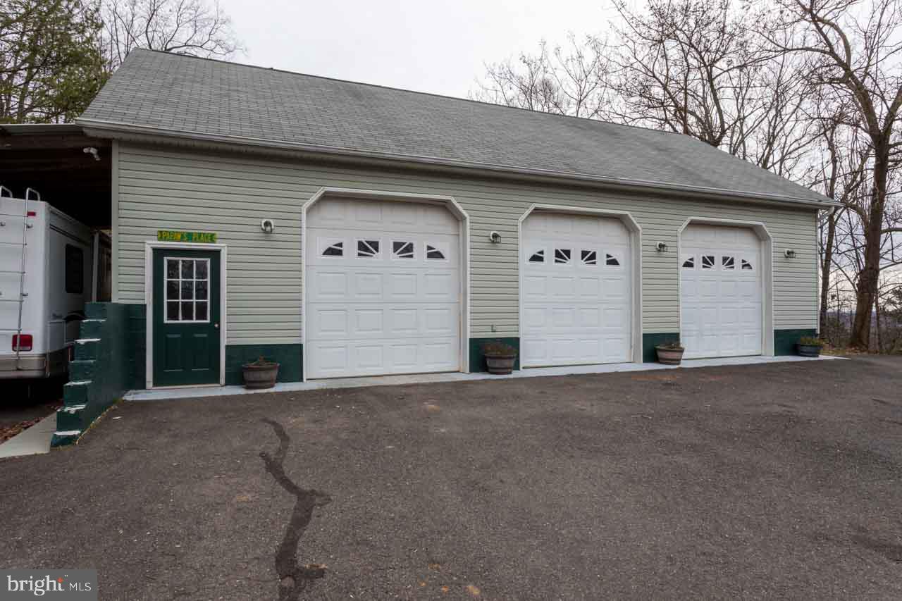 6340 Intervale Road Reva, VA 22735 - Photo 8 of 29 Over sized doors, storage in attic and shed roof.
