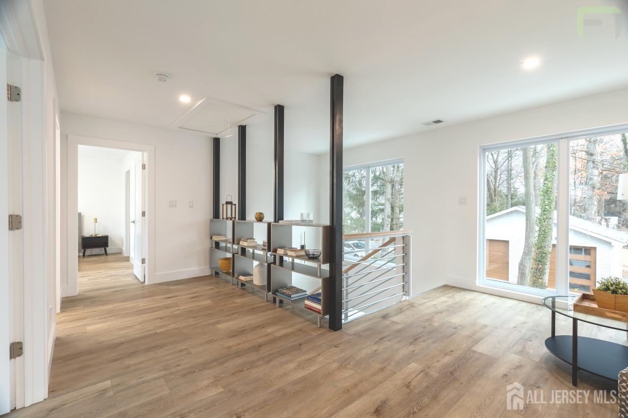 274 Paterson Road Fanwood, NJ 07023 - Photo 15 of 31 a view of an empty room with window and wooden floor