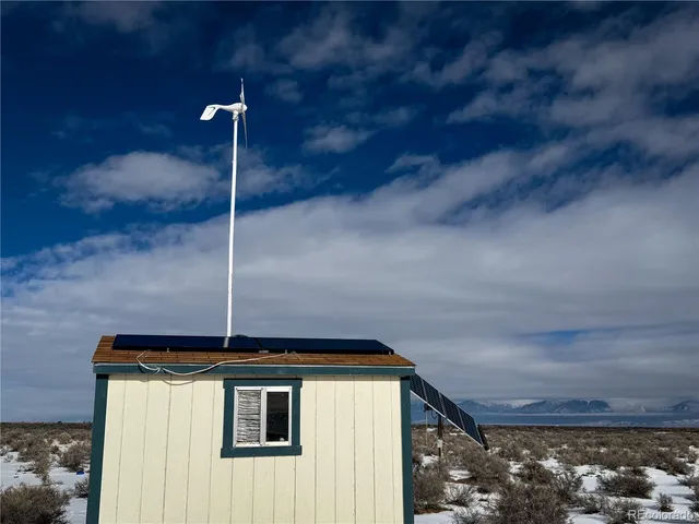 a bed room with a bed and a chandelier