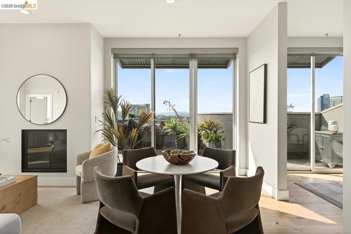 201 4th Street, Unit 601 Oakland, CA 94607 - Photo 11 of 58 a view of a dining room with furniture window and wooden floor