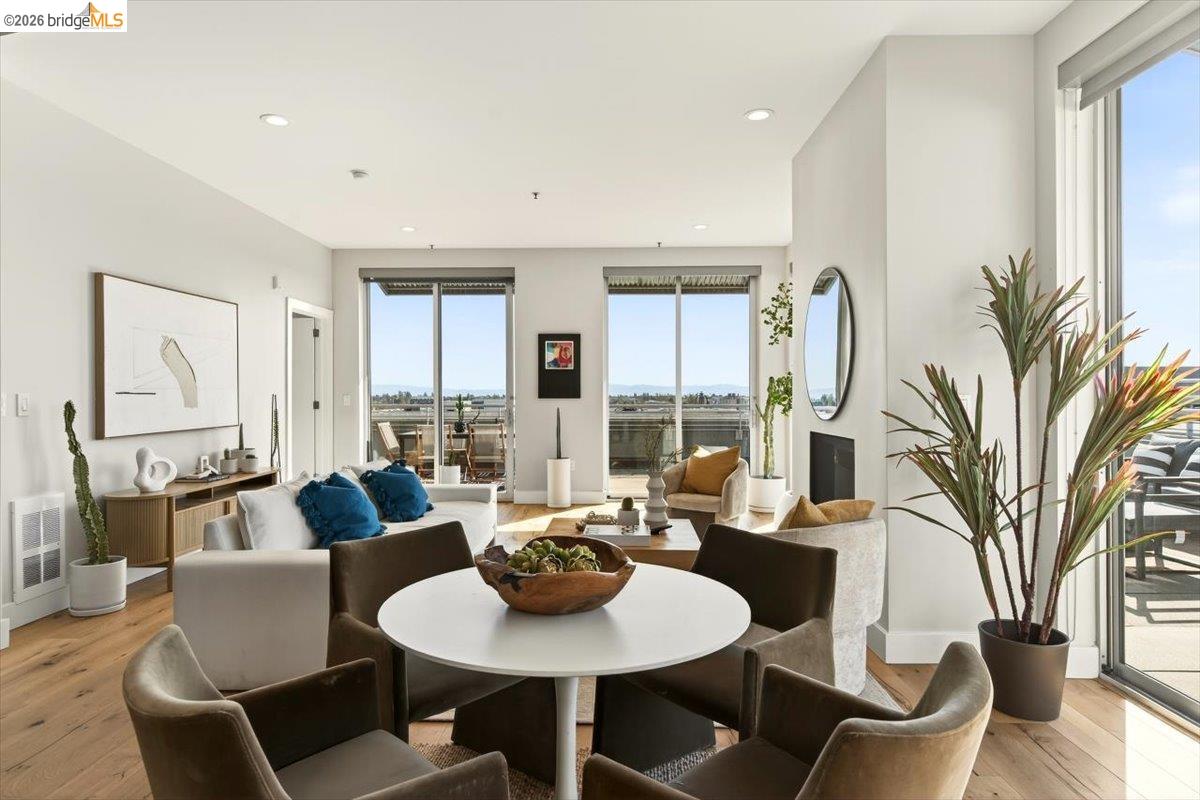 201 4th Street, Unit 601 Oakland, CA 94607 - Photo 13 of 58 a living room with furniture potted plant and a large window