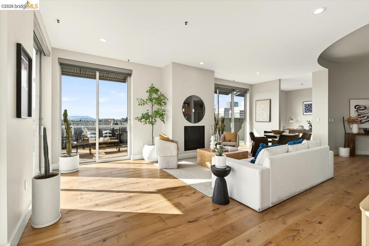 201 4th Street, Unit 601 Oakland, CA 94607 - Photo 19 of 58 a living room with fireplace furniture and a large window