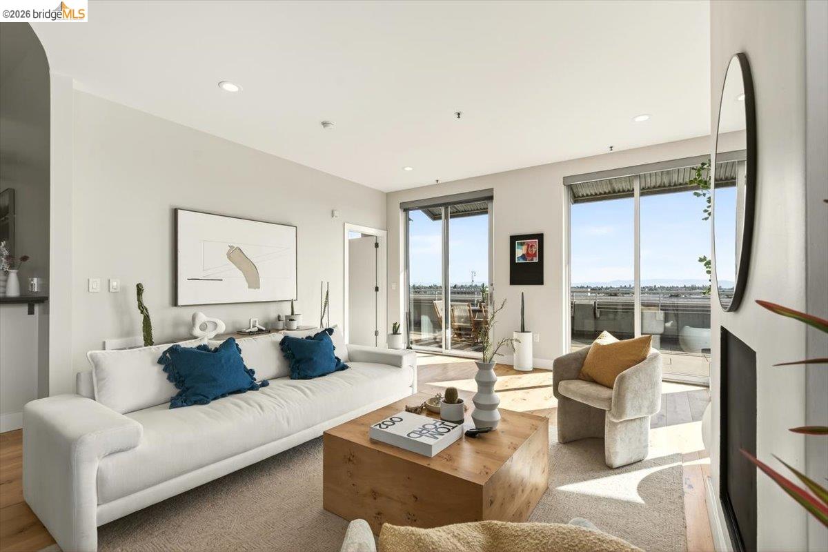 201 4th Street, Unit 601 Oakland, CA 94607 - Photo 21 of 58 a living room with furniture and a large window