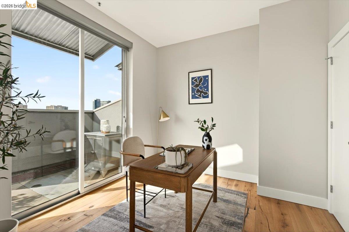 201 4th Street, Unit 601 Oakland, CA 94607 - Photo 28 of 58 a dining room with furniture and wooden floor