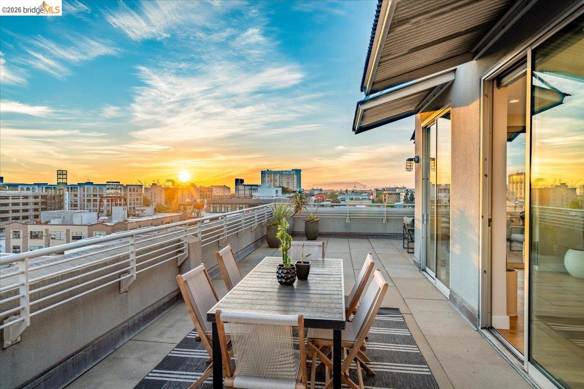 201 4th Street, Unit 601 Oakland, CA 94607 - Photo 50 of 58 a view of a balcony with table and chairs