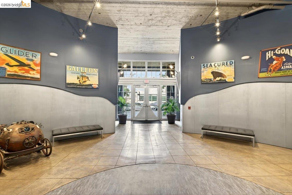 201 4th Street, Unit 601 Oakland, CA 94607 - Photo 7 of 58 a bedroom with a bed and glass walk in closet