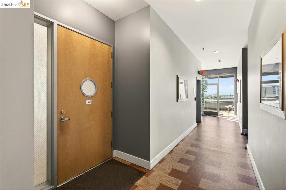 201 4th Street, Unit 601 Oakland, CA 94607 - Photo 8 of 58 a view of a hallway with wooden floor