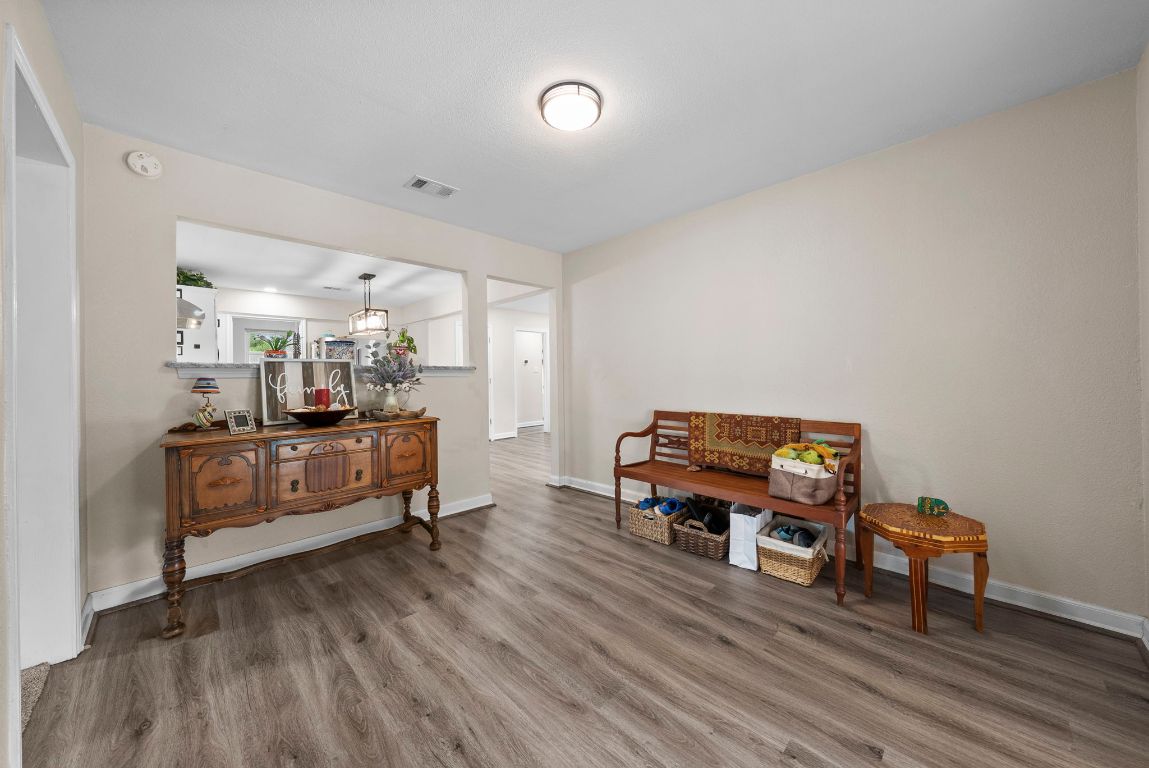 2702 Double Tree Street Round Rock, TX 78681 - Photo 15 of 35 a room with furniture and a wooden floor