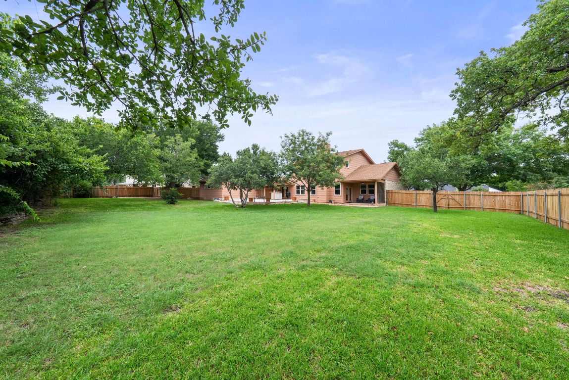 2702 Double Tree Street Round Rock, TX 78681 - Photo 2 of 35 a view of house with garden space and trees