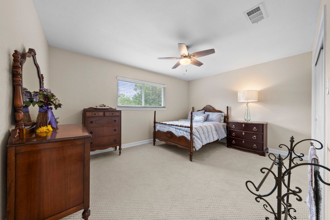 2702 Double Tree Street Round Rock, TX 78681 - Photo 29 of 35 a bedroom with furniture and a window