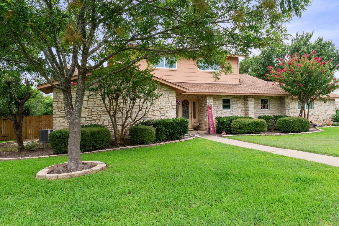 2702 Double Tree Street Round Rock, TX 78681 - Photo 3 of 35 a front view of a house with a yard