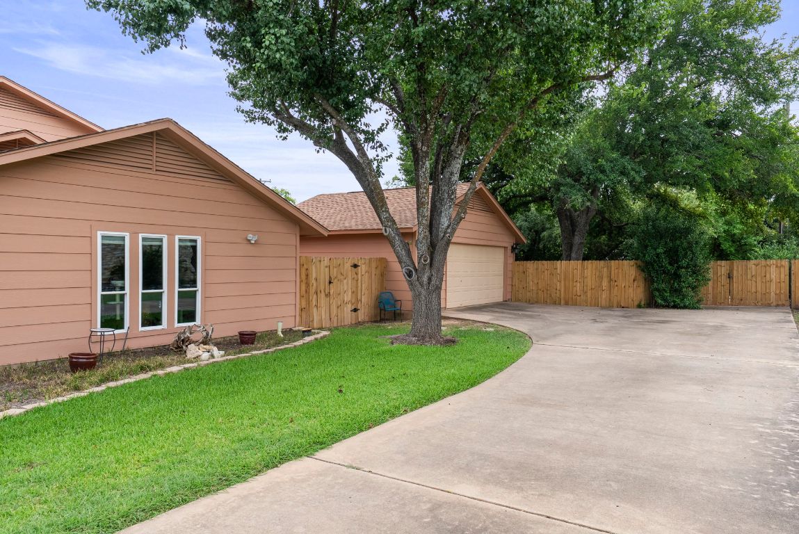 2702 Double Tree Street Round Rock, TX 78681 - Photo 35 of 35 a front view of house with a yard and an trees