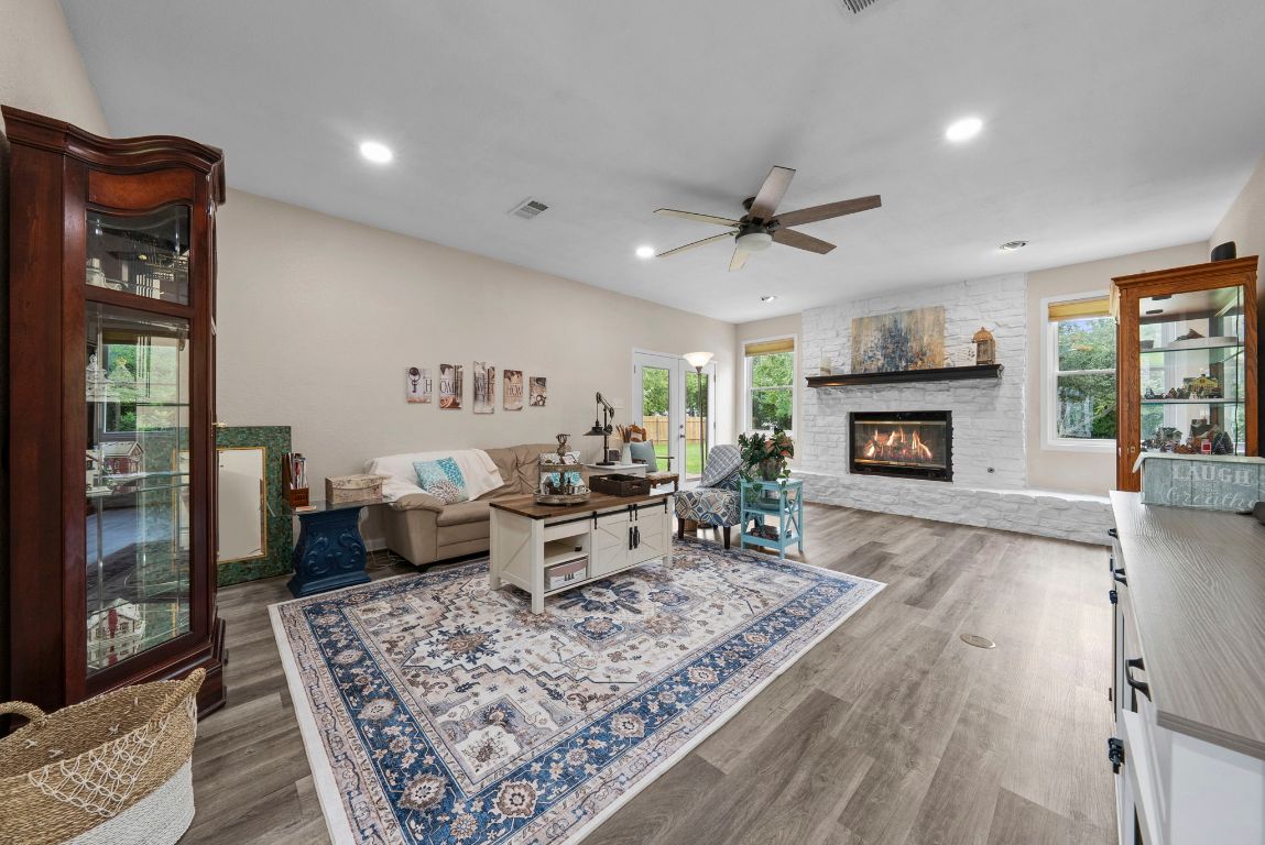 2702 Double Tree Street Round Rock, TX 78681 - Photo 4 of 35 a living room with furniture and a fireplace