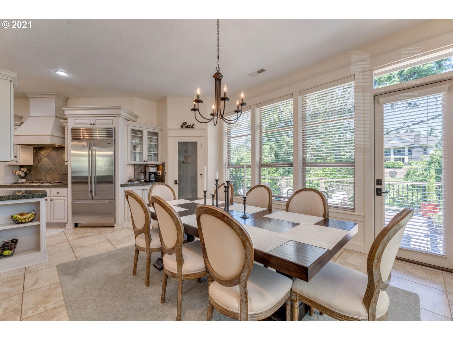 14683 Southeast Aldridge Road Happy Valley, OR 97086 - Photo 11 of 31 a dining room with furniture a chandelier and wooden floor
