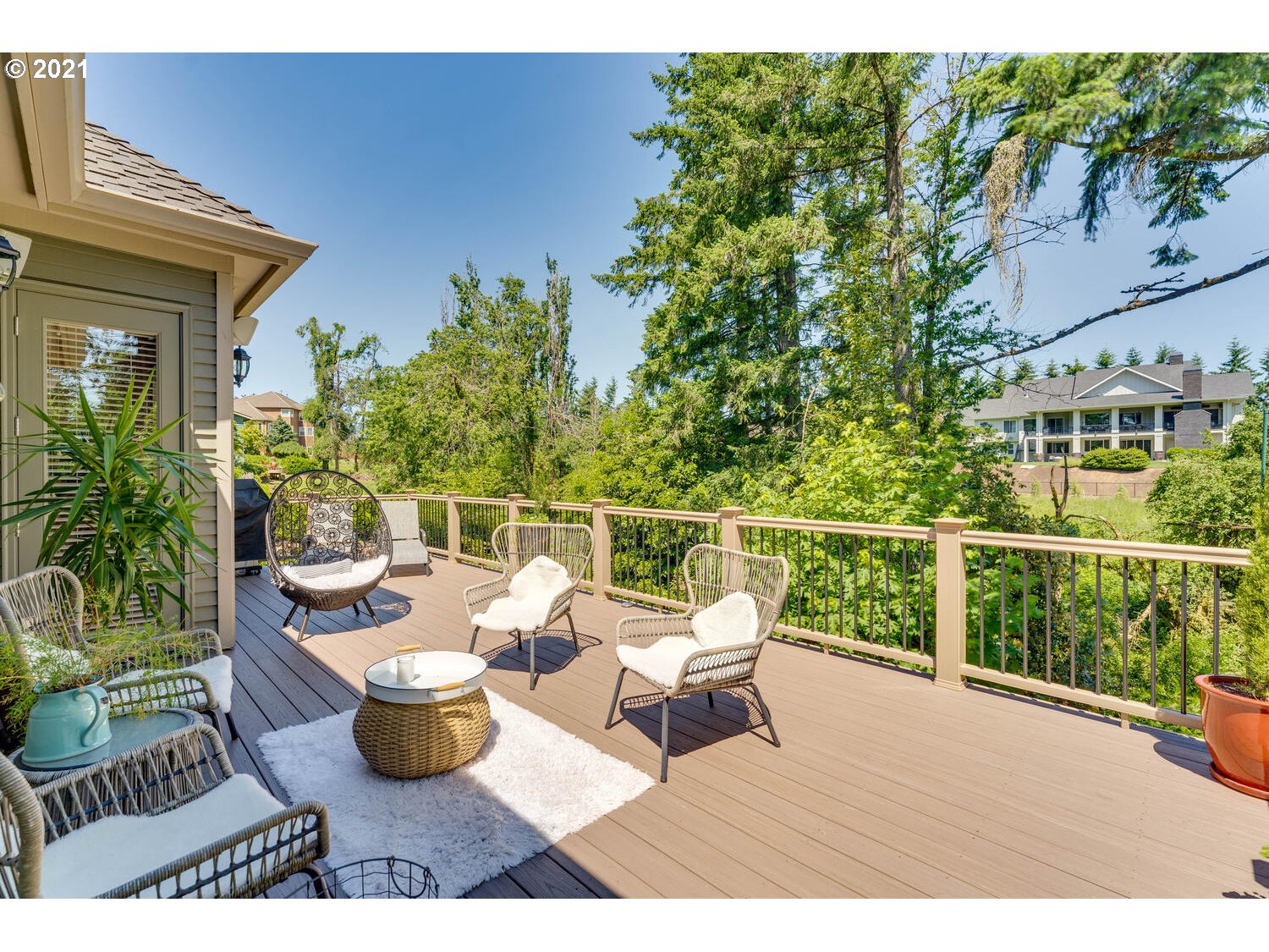 14683 Southeast Aldridge Road Happy Valley, OR 97086 - Photo 12 of 31 a view of a balcony with chairs and potted plants