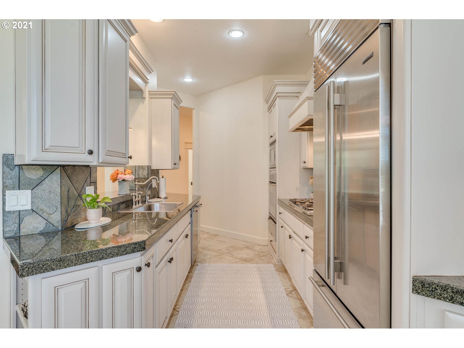 14683 Southeast Aldridge Road Happy Valley, OR 97086 - Photo 14 of 31 a kitchen with granite countertop a sink and cabinets
