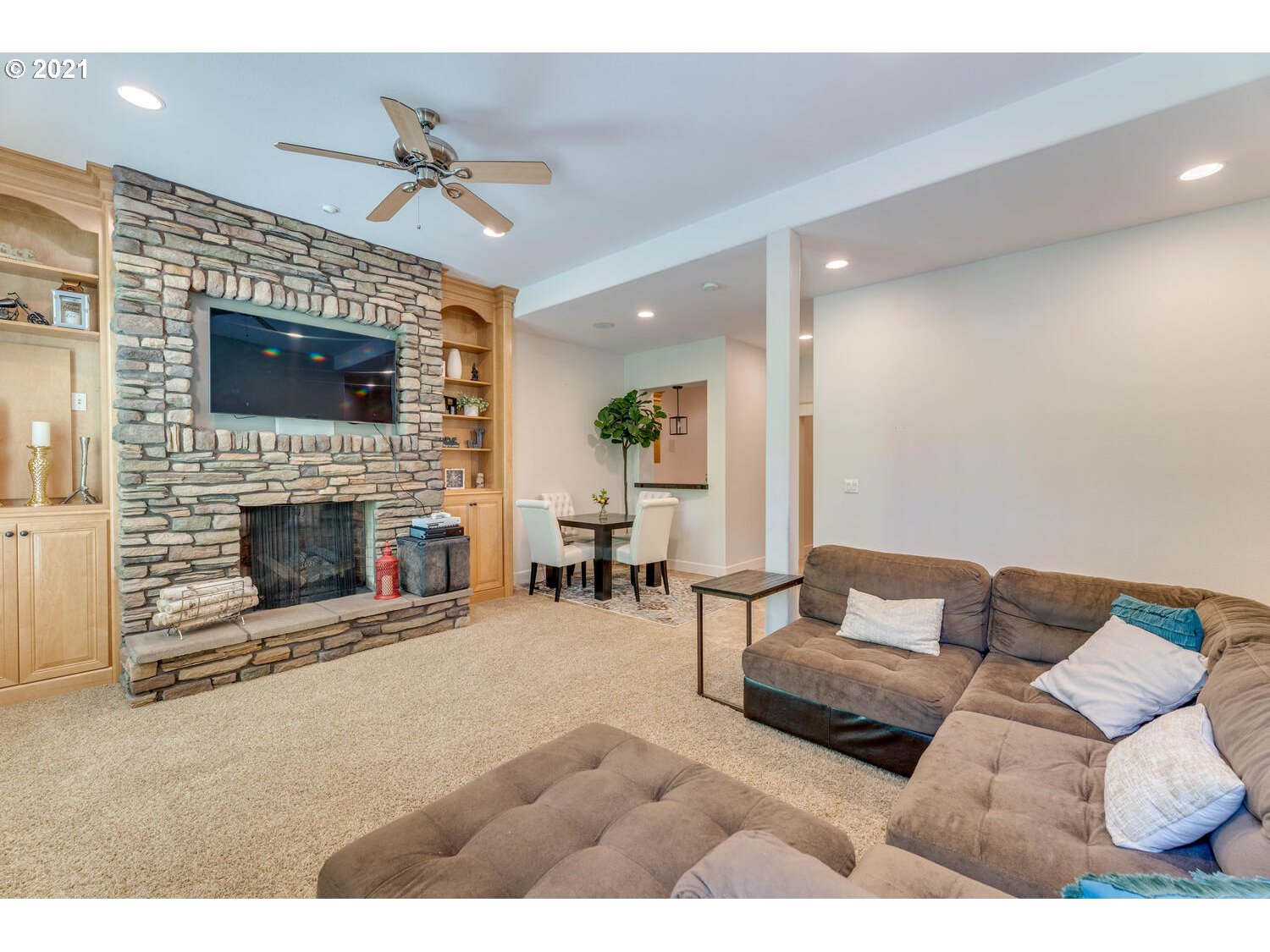 14683 Southeast Aldridge Road Happy Valley, OR 97086 - Photo 22 of 31 a living room with furniture a flat screen tv and a fireplace