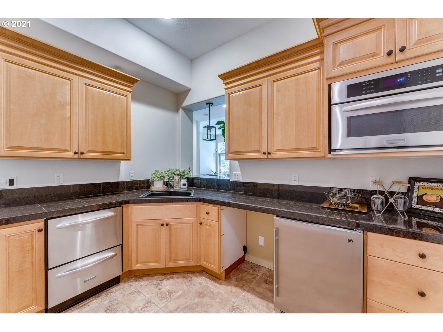 14683 Southeast Aldridge Road Happy Valley, OR 97086 - Photo 25 of 31 a kitchen with granite countertop white cabinets and stainless steel appliances