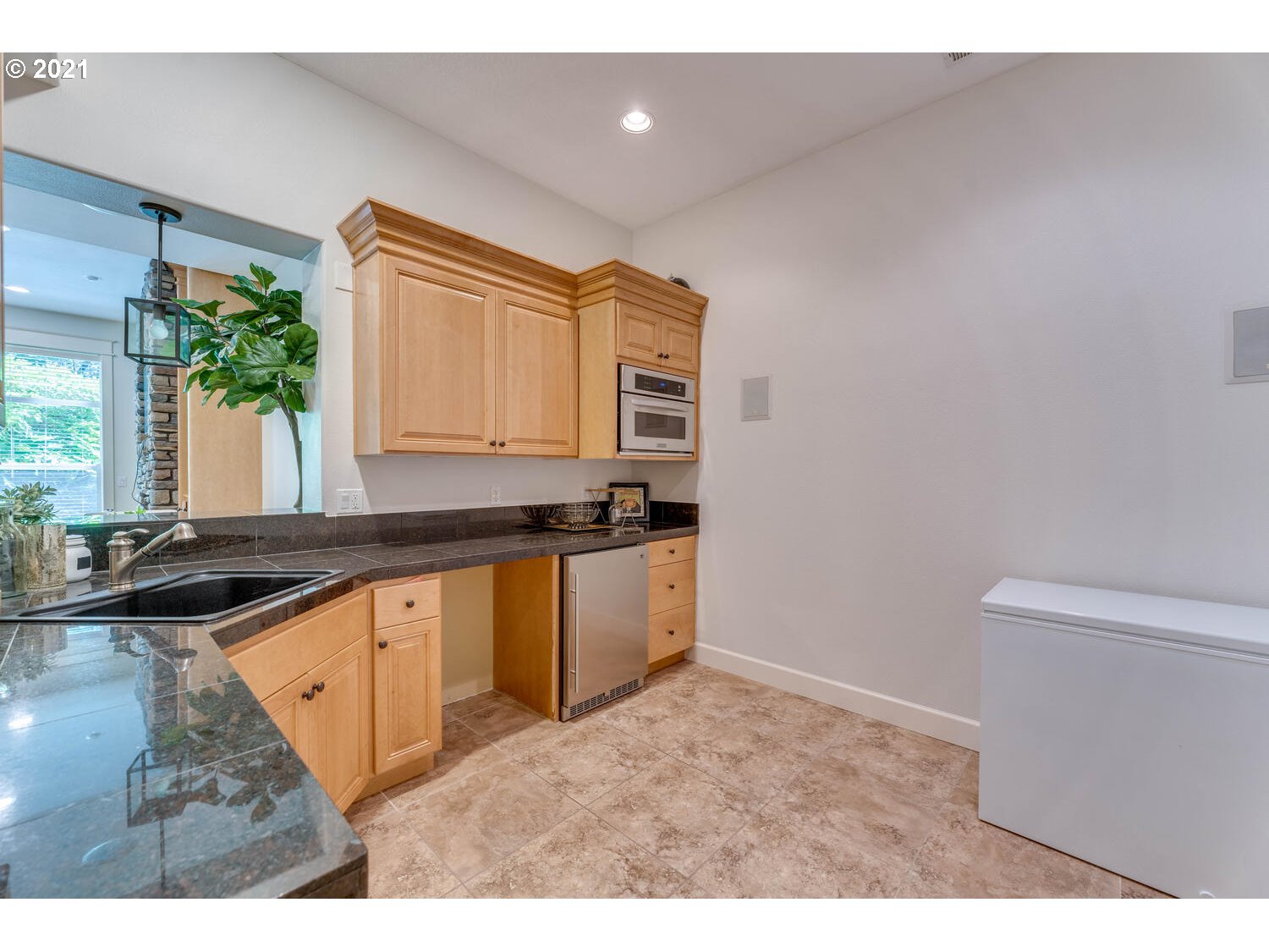 14683 Southeast Aldridge Road Happy Valley, OR 97086 - Photo 26 of 31 a kitchen with granite countertop a sink and a stove