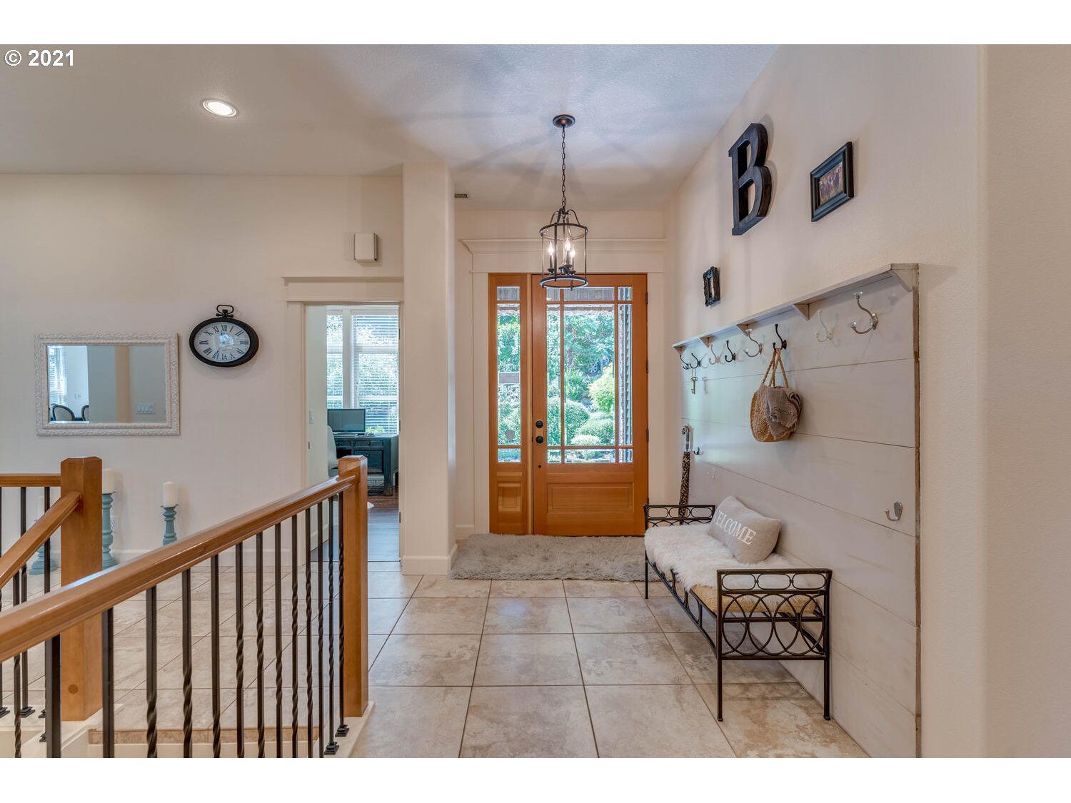 14683 Southeast Aldridge Road Happy Valley, OR 97086 - Photo 3 of 31 a view of a hallway to a livingroom with furniture and windows