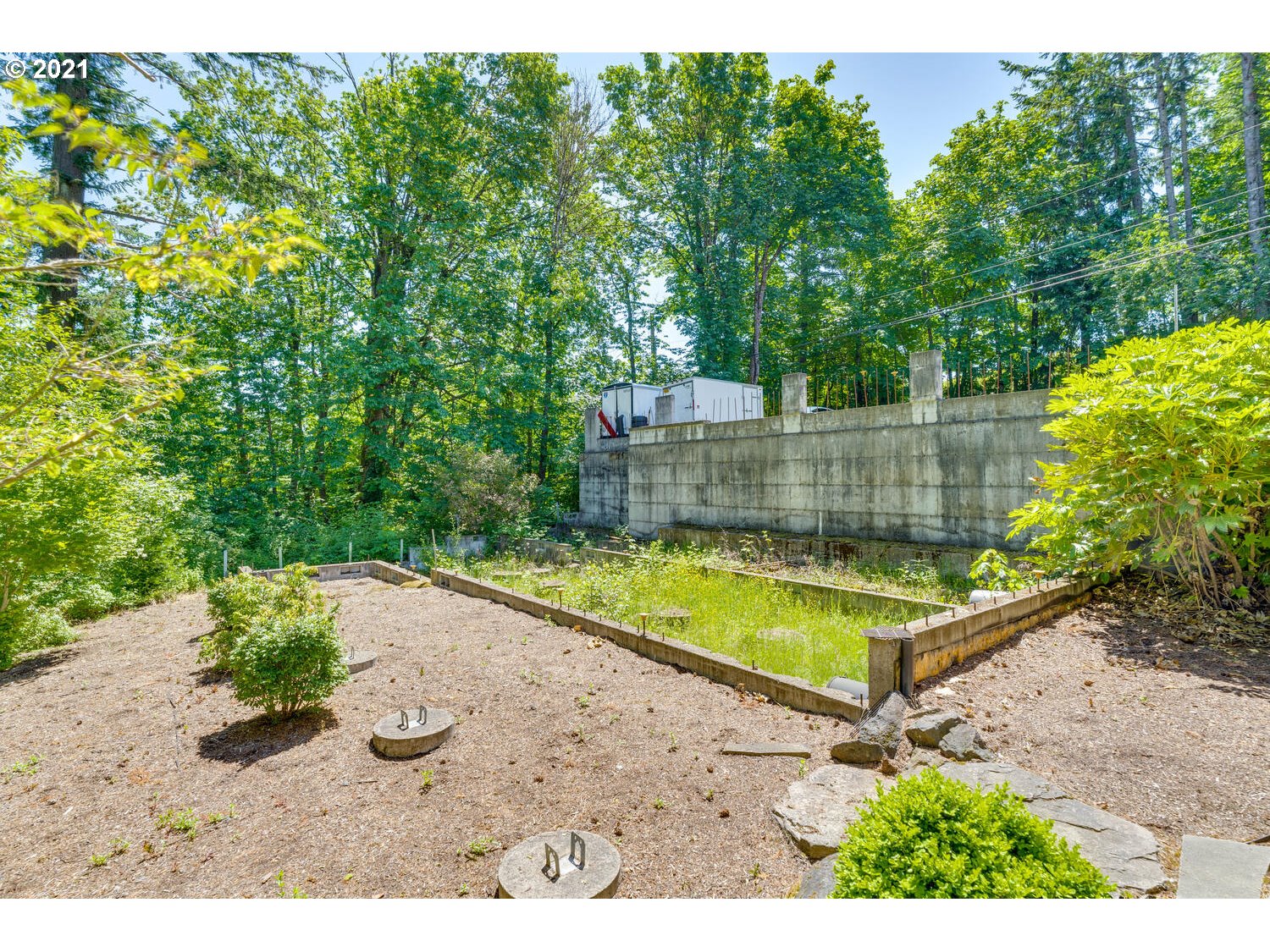14683 Southeast Aldridge Road Happy Valley, OR 97086 - Photo 31 of 31 a view of a backyard with a large pool and outdoor seating
