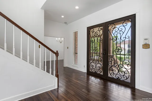 a view of an entryway with wooden floor