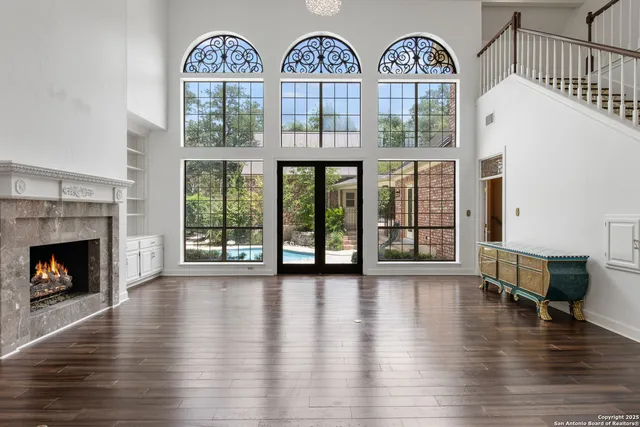 a view of hall way with furniture and fireplace