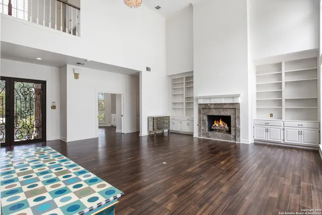 a view of livingroom with hardwood floor and a fireplace