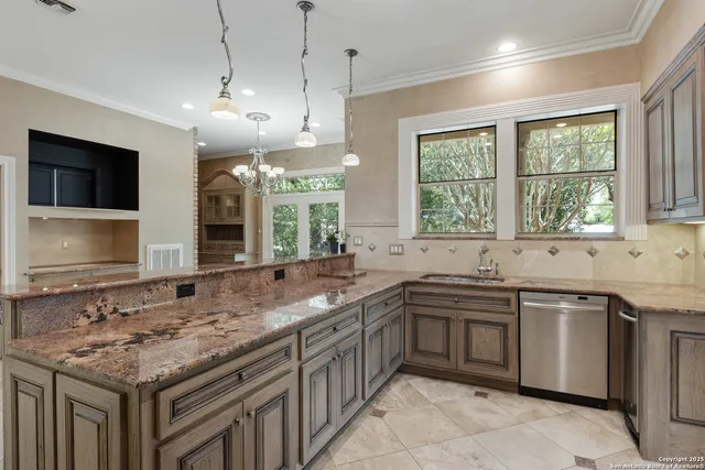 a kitchen with lots of counter space sink and appliances